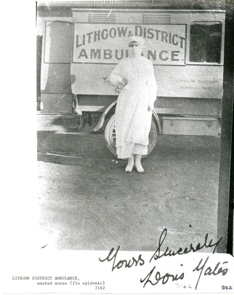 A masked nurse of the Lithgow District Ambulance during the 1918–1920 flu pandemic (courtesy Lithgow Library).