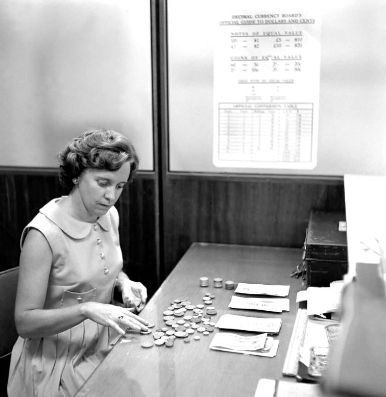 An employee at Waltons (a now-defunct department store chain in Sydney) training for the introduction of decimal currency in 1966.