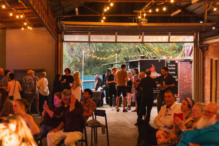 A crowd gathers for a function at The Station Creative Workspace in Wagga Wagga