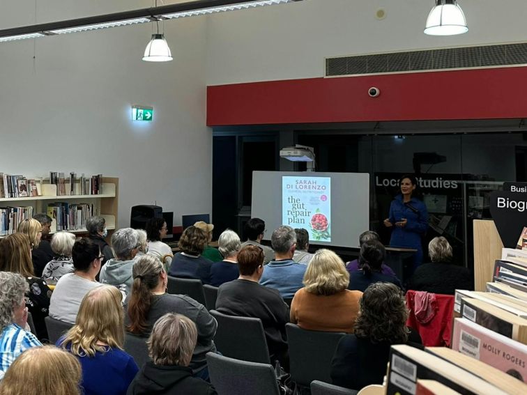 Sarah Di Lorenzo talking about her book the Gut Repair Plan in front of Library audience