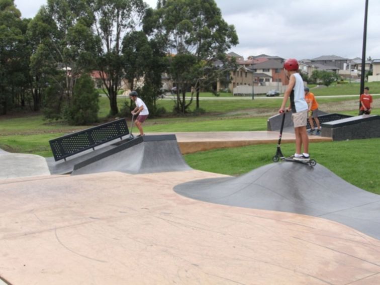 children playing at skate park