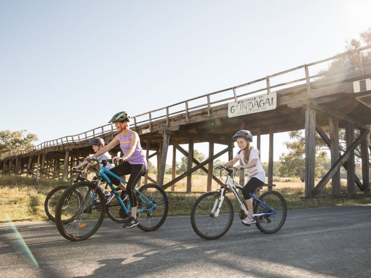 Bike riders under the bridge