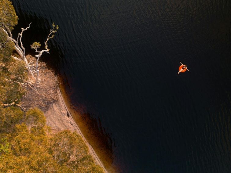 Aerial of lady on floaty