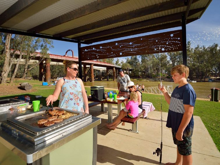 Family enjoying a BBQ at Moama Beach