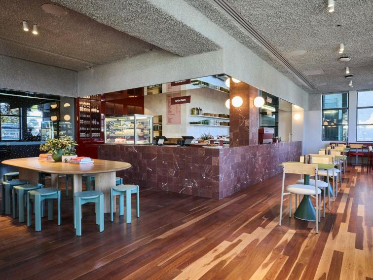 Inside the Cafe at MCA with tables, chairs and a counter