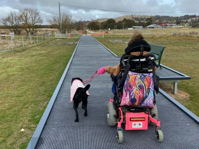 Wheelchair on river walk platform