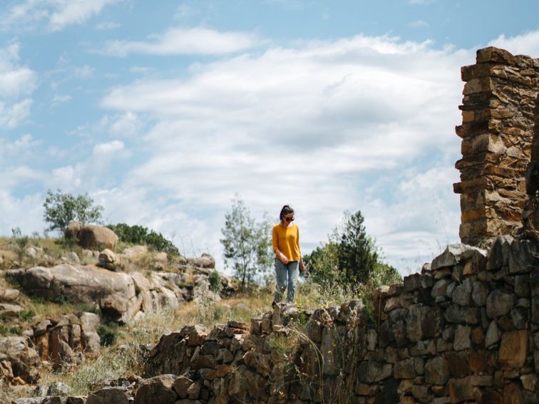 Person wandering Adelong Falls Gold Mill Ruins