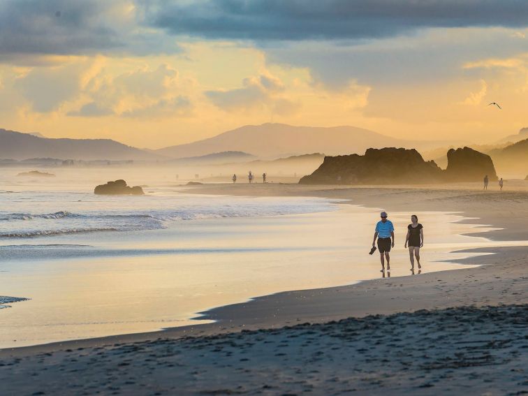 Sunset stroll along Lighthouse Beach