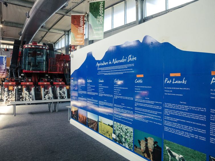 Inside of Narrabri Region Visitor Information Centre showcasing red cotton picker