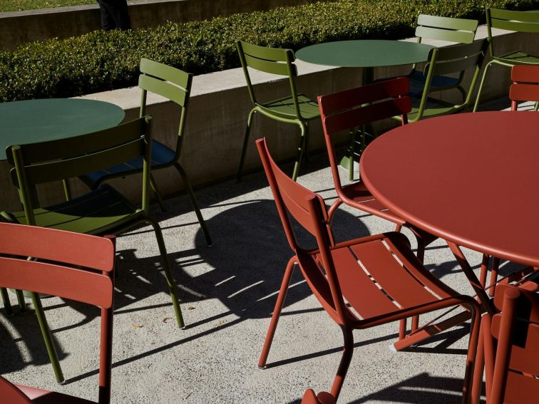 Tables and chairs on the outside terrace at MCA Cafe