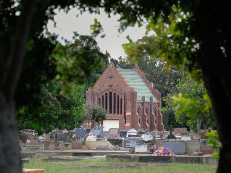 historic chapel surrounded by gravestones