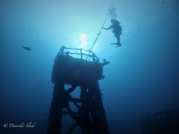 Divers waiting at top of main mast