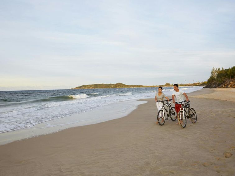 A couple enjoying Belongil Beach, Byron Bay