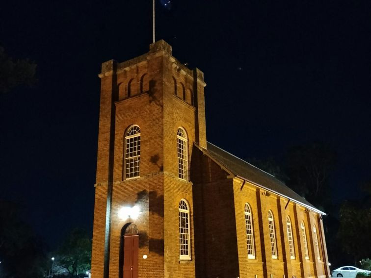 An image of a gothic church at night