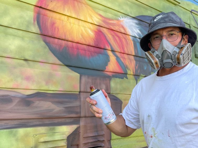 Dan Bianco painting the Gresford Butchers Mural