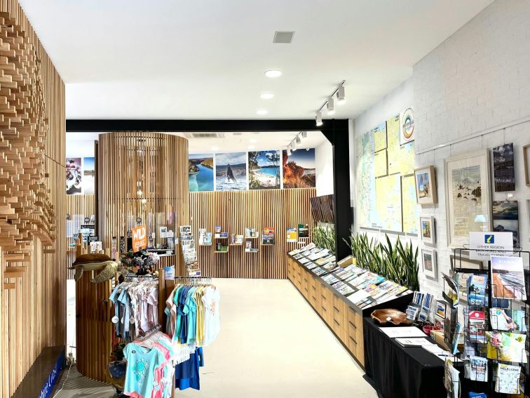 Looking towards the centre of the space, clothing on the left with brochures on the right