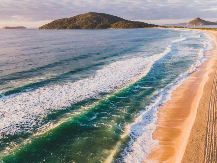 Sun rising over Bennetts Beach, Hawks Nest