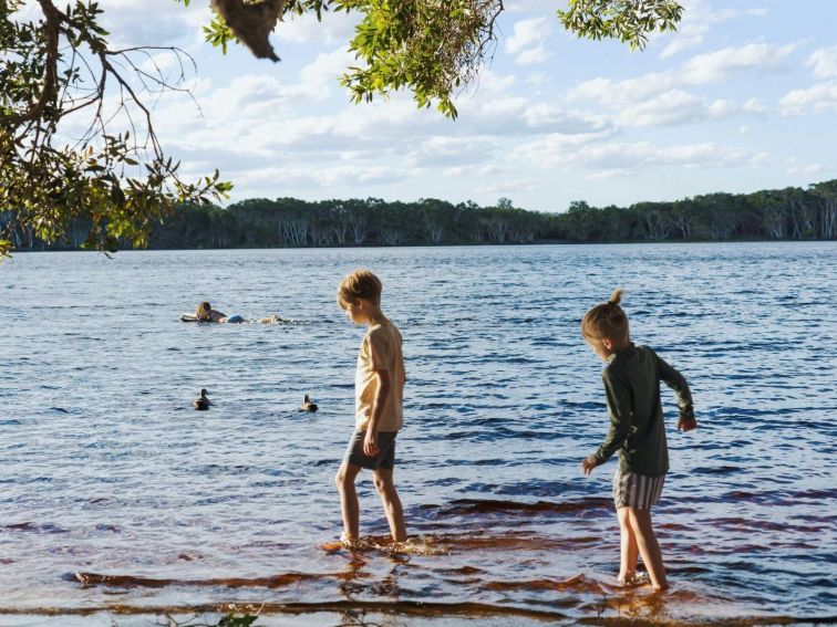 Kids walking in lake