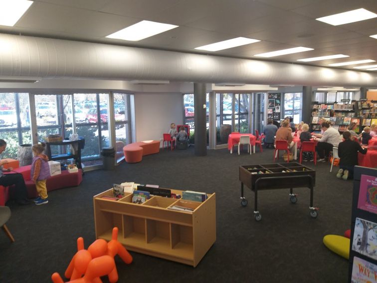 Small chairs, tables and bookshelves at childrens area