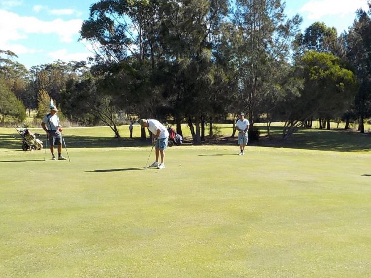 Some of the locals putting on the 7th green