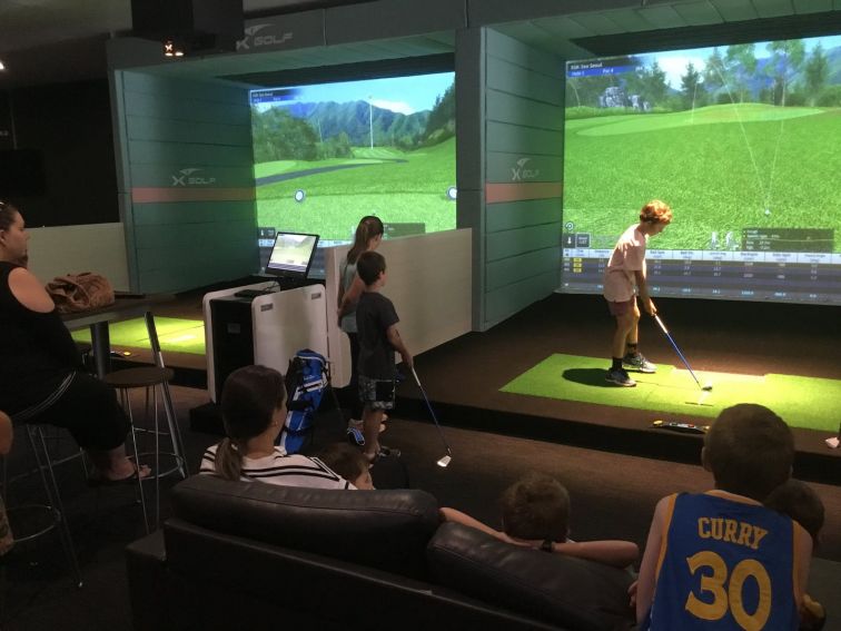 Kids playing at X-Golf