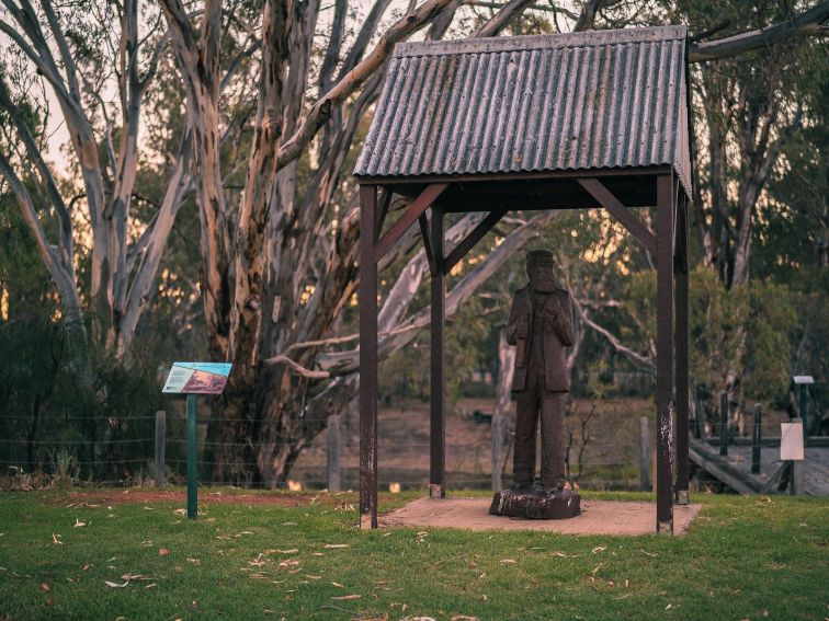 Wooden sculpture of riverboat captain