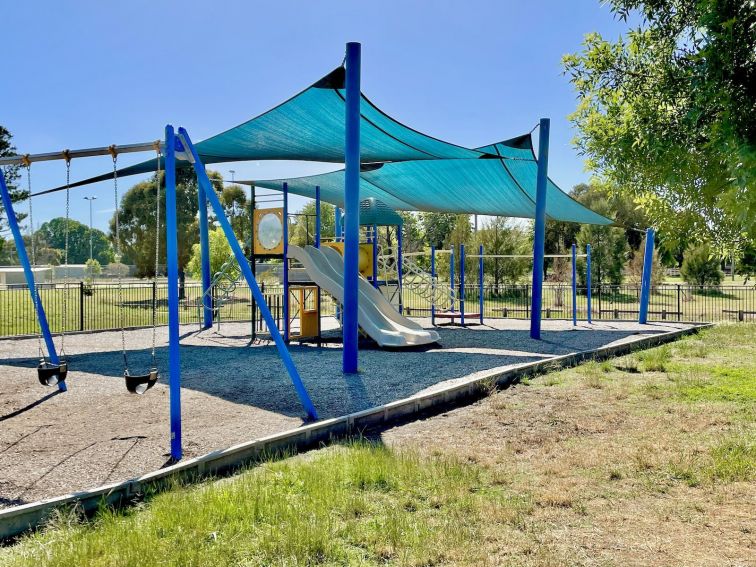 Playground with slide, swings and climbing equipment