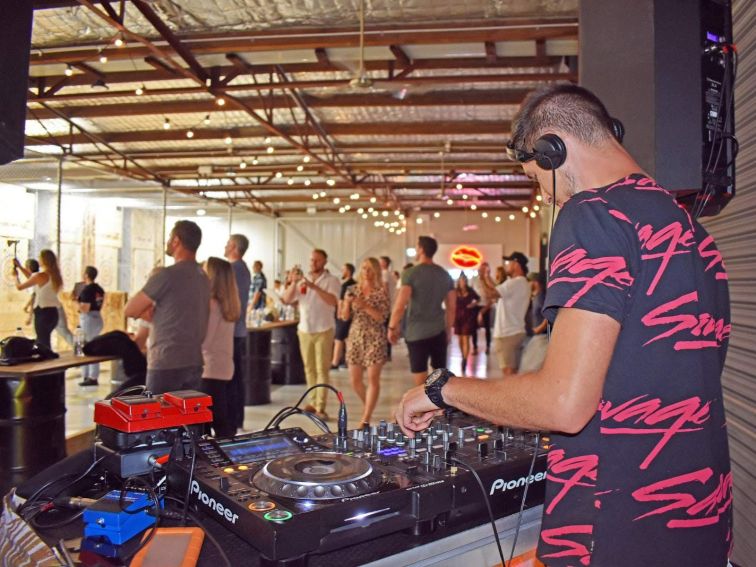 DJ at axe throwing venue