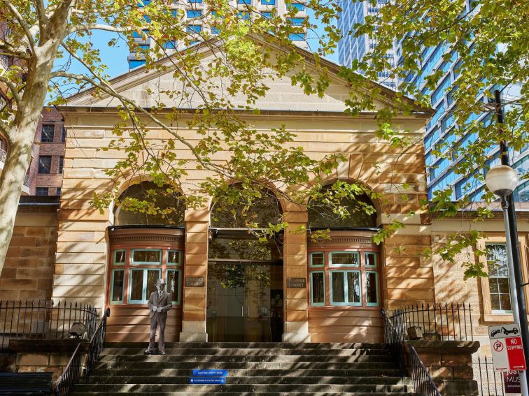 The sandstone facade of the Justice & Police Museum in dappled sunshine.