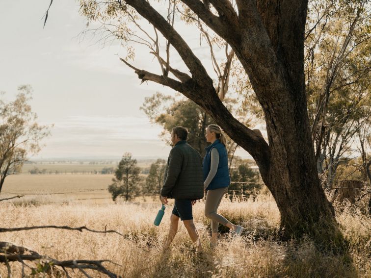 Couple enjoying the view of wide open spaces over farm land from Redlands Hills Reserve