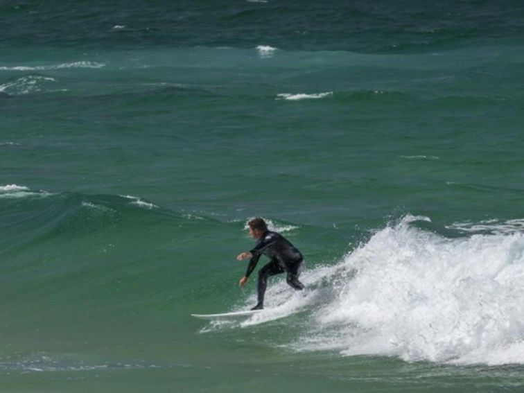 A surfer riding the waves at Bingi Bingi Point in Eurobodalla National Park. Photo: David Finnegan