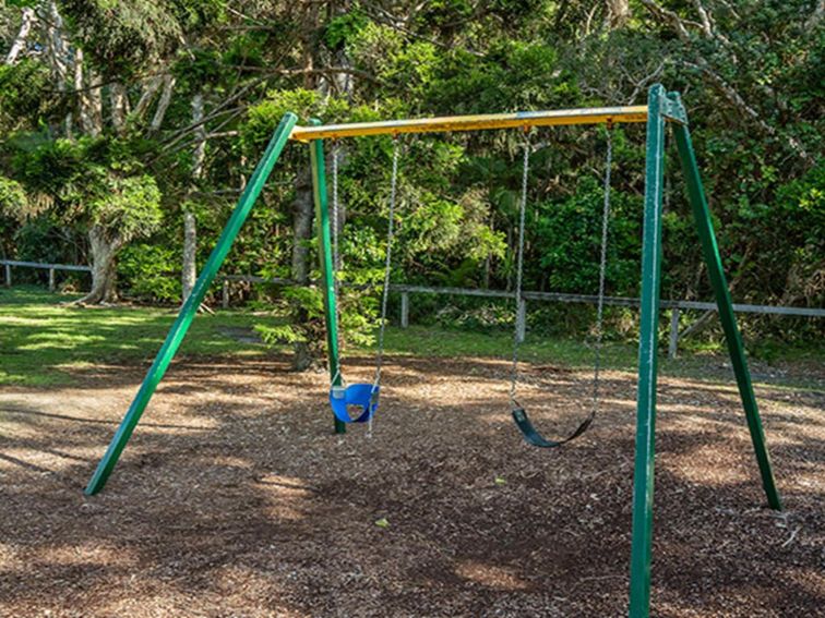 A swing set at Broken Head picnic area in Broken Head Nature Reserve. Photo: John Spencer/DPIE