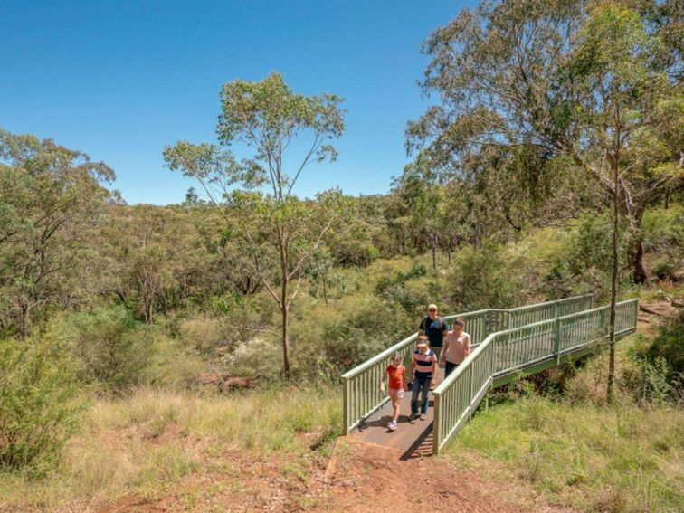 Family walking in Burning Mountain Nature Reserve walking track. Credit: John Spencer &copy; DPE