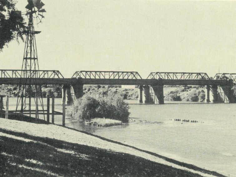 Victoria Bridge in penrith with rowers on river and windmill