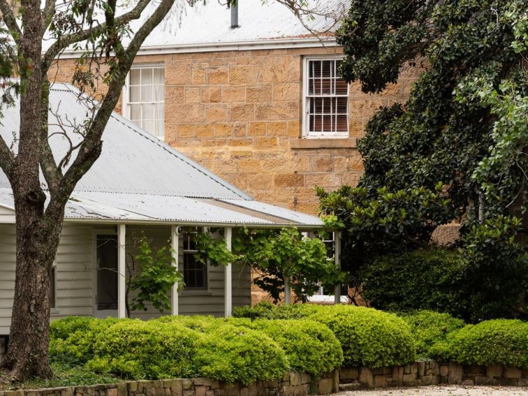 A sandstone exterior image of the historic Homestead, built in 1866