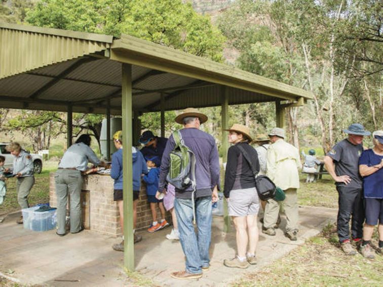 A group enjoying a barbecue at Canyon picnic area in Warrumbungle National Park. Photo: Simone