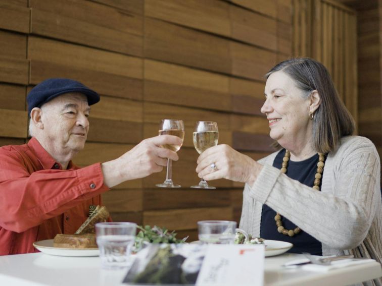 Two guests enjoy a glass of wine in the Gallery cafe