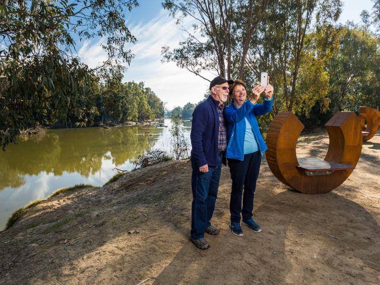 Couple taking a selfie at Oura Beach Reserve near Wagga Wagga