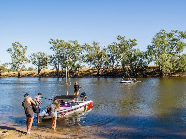 Boat on shore at ski dam