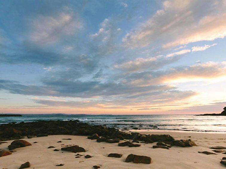 Sunset over a beach in Eurobodalla National Park. Photo: David Finnegan &copy; DPIE