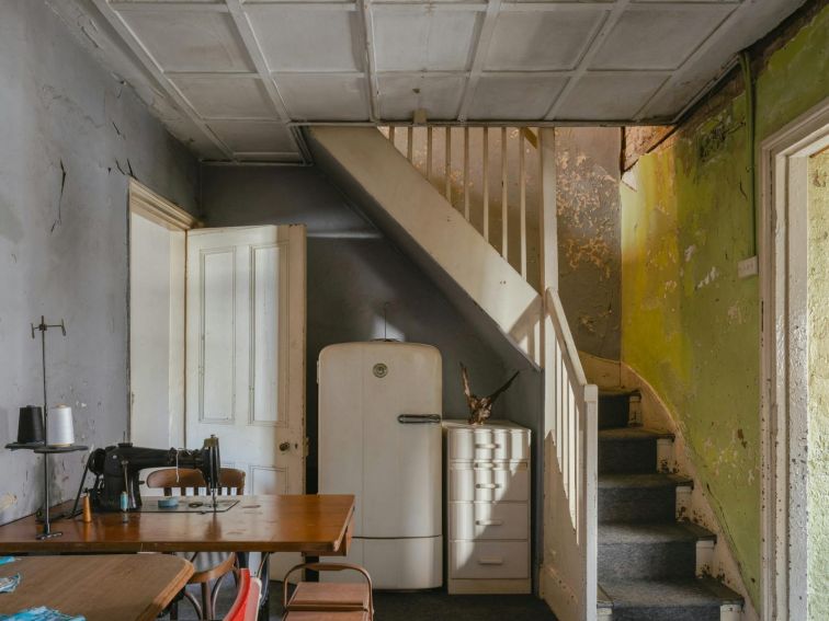 Historic kitchen with stairs leading upstairs