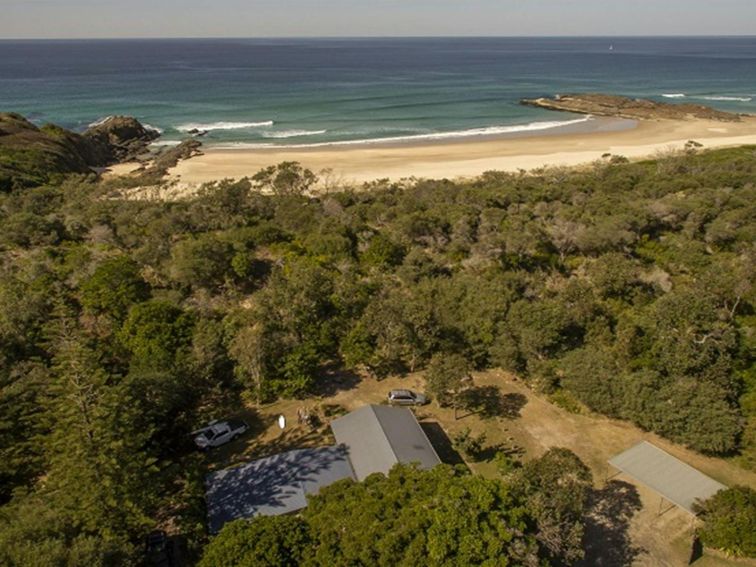 An aerial photo of Plomer Beach House and coastal views at Limeburners Creek National Park. Photo: