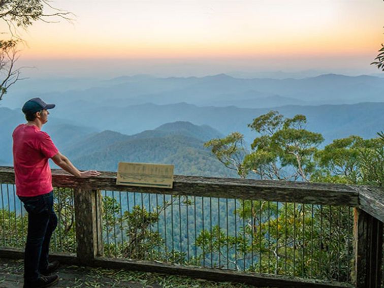 Visitor looking at views of New England National Park from Point Lookout. Photo: John Spencer/OEH