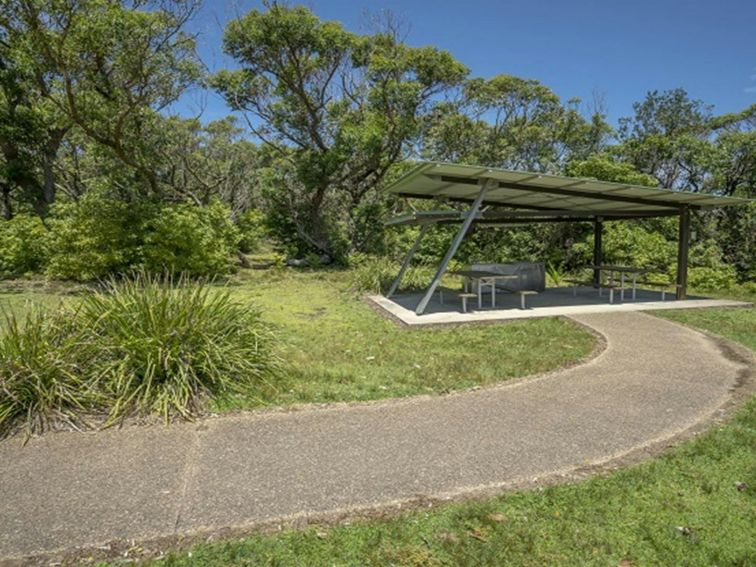 Covered picnic tables at Pretty Beach picnic area. Photo credit: John Spencer &copy; DPIE