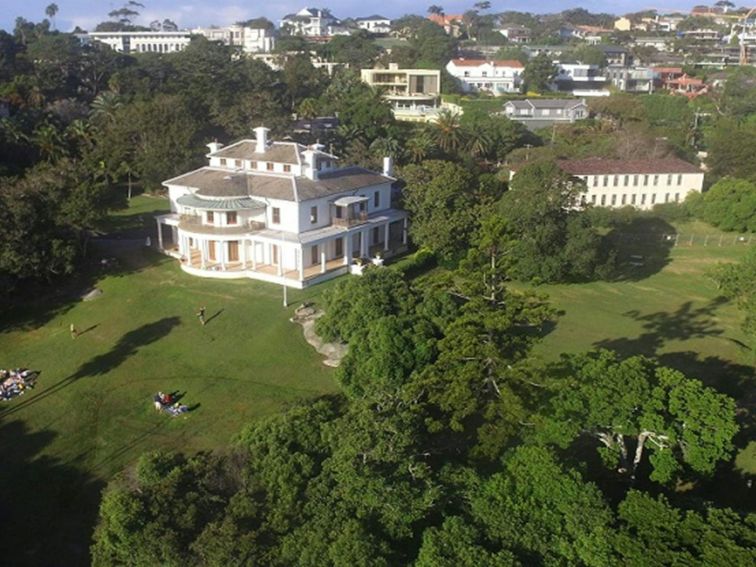 Aerial view of Strickland Estate extensive gardens and grounds, with picnickers relaxing on the lawn