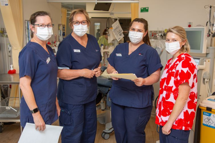 nursing staff in huddle