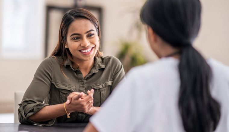 A psychologist speaking to a patient