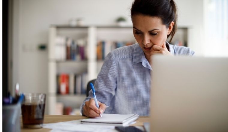 Female using a laptop in her home