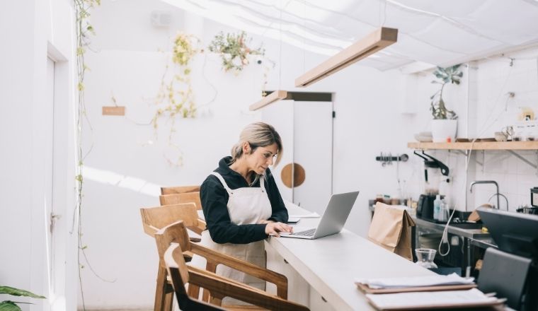 Female business owner working on a laptop