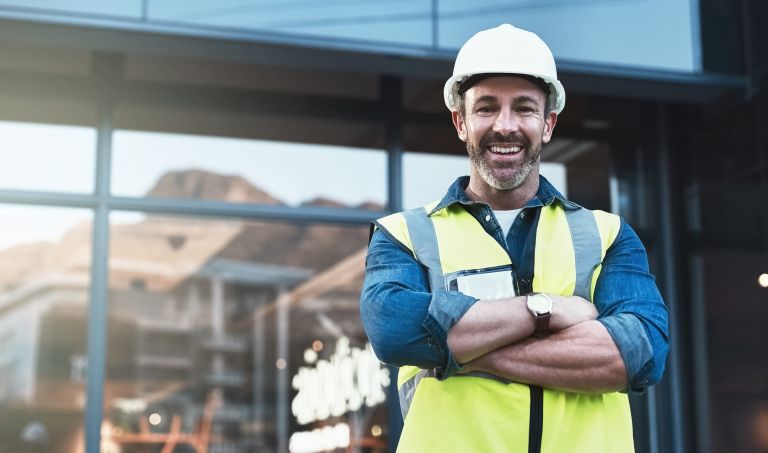 Man smiling in a hard hat